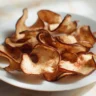 Homemade air fryer apple chips, a healthy snack option.