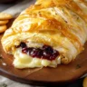 Delicious baked brie wrapped in phyllo dough, topped with herbs and spices.