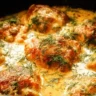 Creamy oven baked chicken thighs dish served on a plate