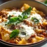 Bowl of Crockpot Lasagna Soup loaded with cheese and herbs