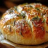 Homemade roasted garlic rosemary artisan bread fresh out of the oven.