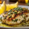 Mediterranean herb crusted grilled chicken on a serving plate