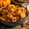 A bowl of homemade Pumpkin Spice Chex Mix with seasonal spices and crunchy ingredients