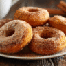 Two-ingredient pumpkin donuts on a cooling rack