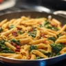 One-Pot Spinach Tomato Pasta recipe with fresh ingredients and vibrant colors