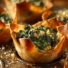 Savory spinach and artichoke filling in crispy wonton cups