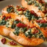 Stuffed salmon featuring spinach and feta cheese, cooked to perfection.