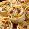 A variety of delicious appetizers including pinwheels and bite-sized treats.