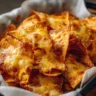 Delicious Air Fryer Nachos topped with cheese and jalapeños.