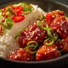 Crispy Air Fryer Sesame Chicken served with sesame seeds and green onions