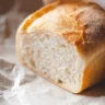 Loaf of fresh Amish white bread on a wooden table