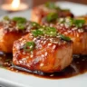 Bang Bang Salmon Bites served on a plate with garnishes