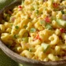 Delicious bowl of best macaroni salad with vegetables and dressing
