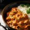 Crockpot Butter Chicken served with rice and garnished with cilantro