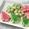 Easy Christmas spritz cookies decorated for holiday celebrations.