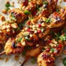 Easy grilled chicken skewers with honey garlic sauce on a barbecue grill