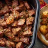 Delicious garlic butter steak bites sizzling in a pan.