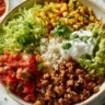Colorful Healthy Turkey Taco Bowl with fresh vegetables and toppings