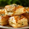 Herb and cheese stuffed puff pastry bites on a platter