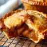 Delicious mini apple pies arranged on a plate, ready to be enjoyed.