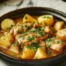 Slow Cooker Parmesan Garlic Chicken with crispy potatoes served on a plate.