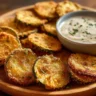 Super crispy air fried zucchini chips in a bowl, a perfect keto snack