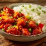 Delicious sweet and sour chicken recipe with vibrant vegetables and sauce