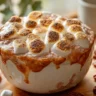 Sweet potato casserole topped with marshmallows ready for baking