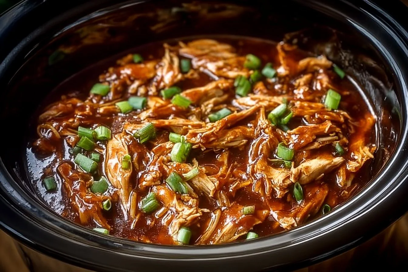 Delicious crock pot bourbon chicken served on a plate