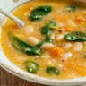 Delicious bowl of homemade white bean soup topped with herbs